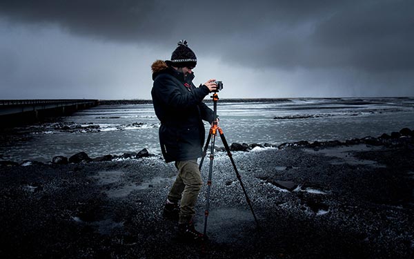 A tripod helps stabilize a camera during long exposures for nighttime photography